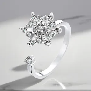 Detailed macro view of an adjustable silver-plated rotating ring with sparkling zircons