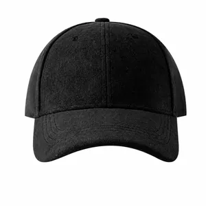 Close-up of a minimalist black suede baseball cap with a fine velvety texture.