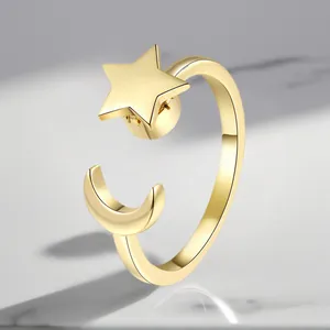 Detailed view of a gold-colored adjustable ring with a rotating star and moon design.