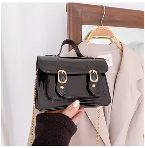 Glossy dark brown jelly Cambridge handbag with gold chain strap and top handle