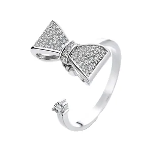 Elegant silver-plated adjustable open ring with a sparkling cubic zirconia bow-tie design