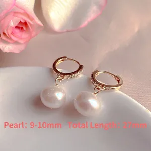 Detailed view of elegant natural freshwater pearl hoop earrings with zircon accents