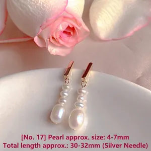 Elegant natural freshwater pearl drop earrings with minimalist gold-tone bar design