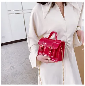 Bright red glossy jelly Cambridge style handbag with elegant gold chain strap for summer