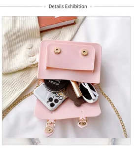 Internal view of pink jelly crossbody bag with magnetic buckle and chain strap