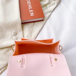Interior view of a pink silicone jelly Cambridge bag featuring a magnetic buckle and chain