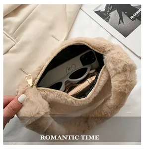 Detailed view of beige fluffy faux fur shoulder bag with items inside showing capacity