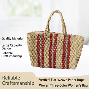 Detailed view of a hand-woven straw tote bag with red and grey vertical stripes