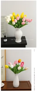 Detail of multi-colored PU artificial tulips in white ceramic vases for home decor.