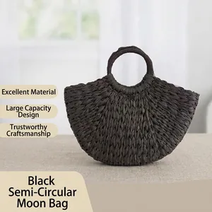 Black woven semi-circular moon bag with round handles for summer fashion detail