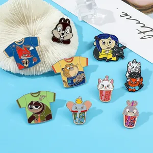 Detailed view of Zootopia and Disney animated character enamel pins on blue background