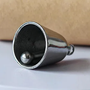 Close-up of polished silver motorcycle luck bell pendant with inner striker.