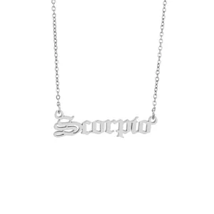 Detailed macro shot of Scorpio zodiac nameplate pendant on silver stainless steel chain necklace