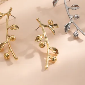 Elegante goldene und silberne Baumblatt-Zweig-Ohrringe im modischen Bohemian-Stil