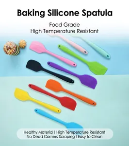 Detailed macro view of multiple colorful heat-resistant silicone spatulas for professional baking.