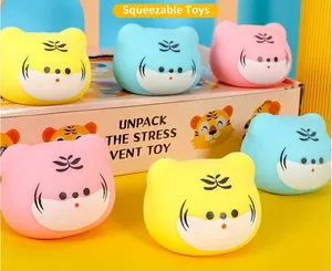 Group of colorful TPR tiger head squishy stress relief toys in a detailed product view