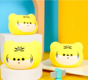 Detailed macro shot of three yellow tiger-shaped TPR stress relief squeeze toys
