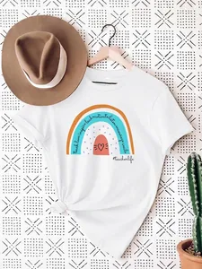 White cotton t-shirt featuring a rainbow graphic with motivational teacher text details