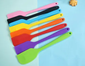 Detailed macro view of 8 colorful heat-resistant silicone spatulas for home baking