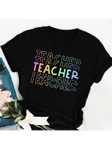 Close-up of black T-shirt featuring colorful 'TEACHER' letter graphic print