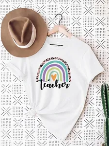 Close-up of a stylish white cotton t-shirt with a Teacher rainbow and heart print