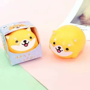 Detailed view of a cute yellow Shiba Inu squishy toy and its original retail box.