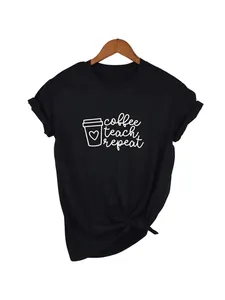 Close-up of 'coffee teach repeat' white print on a black casual cotton T-shirt