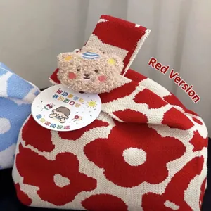Red floral knitted wrist bag for gifts with a cute plush bear decorative ornament