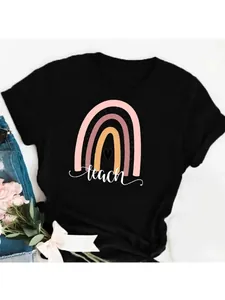 Detailed view of the creative rainbow and teach graphic on a black women's cotton T-shirt