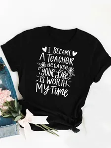 Detailed close-up of inspirational teacher quote white print on a black cotton T-shirt