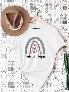 Detailed view of women's white cotton T-shirt featuring a boho rainbow and teach love inspire print.