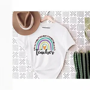 White cotton t-shirt for women featuring a colorful rainbow and Teacher slogan print
