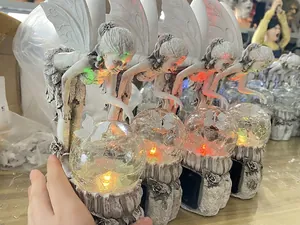 Set of solar powered garden fairy statues with glowing crackle glass crystal balls