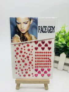 Detail view of face gem stickers packaging featuring red pearls and pink hearts