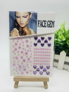 Close-up detail of purple heart crystals and pink pearls for facial makeup decoration