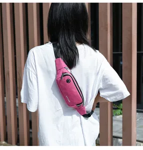 Back view of a woman wearing a pink waterproof fanny pack for running and sports
