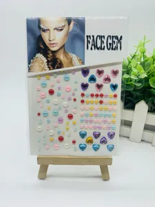 Colorful mixed face gem stickers with pearls and hearts on packaging card