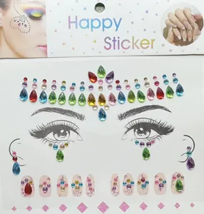 Detail view of colorful crystal face and nail stickers with heart and drop shapes.