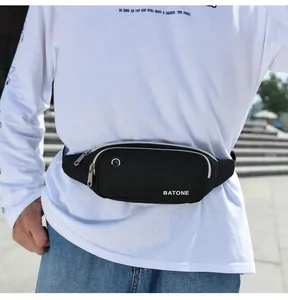 Close-up of black waterproof sports waist bag with headphone hole and BATONE logo.
