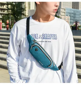Male model wearing a teal lightweight waterproof sports waist bag in an outdoor setting