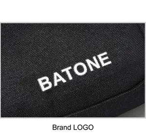 Close-up of BATONE logo printed on black textured waterproof sports waist bag fabric