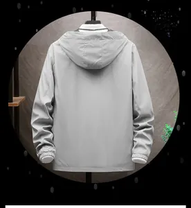 Back view of a stylish minimalist light grey hooded jacket for casual spring wear.