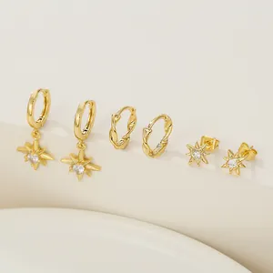 Elegant gold star earring set featuring zircon-inlaid hoops and sunburst stud earrings
