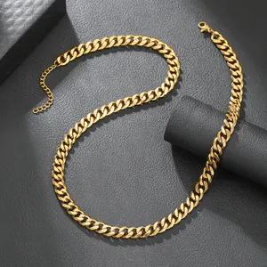 Detail view of a thick gold-plated stainless steel Cuban link chain in punk style