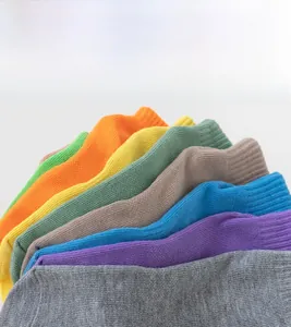 Detail view of various colorful ribbed cotton anti-slip yoga and trampoline socks