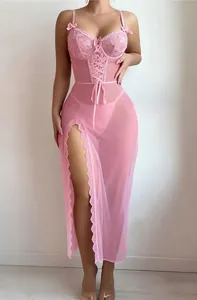 Detail view of pink sheer mesh long dress with lace corset top and high slit