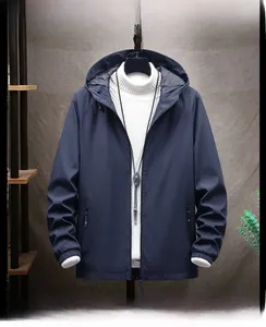 Detailed front view of navy blue hooded jacket styled with white turtleneck sweater