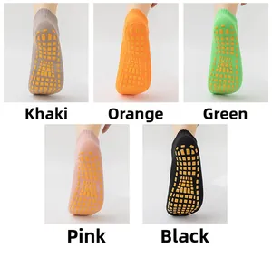 Non-slip trampoline socks in khaki, orange, green, pink, and black colors.