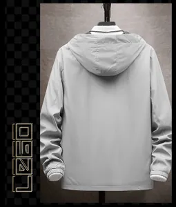 Detailed back view of a minimalist gray hooded jacket with adjustable elastic cuffs