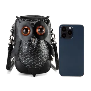 Detailed size comparison of a black owl-shaped punk crossbody bag with a smartphone
